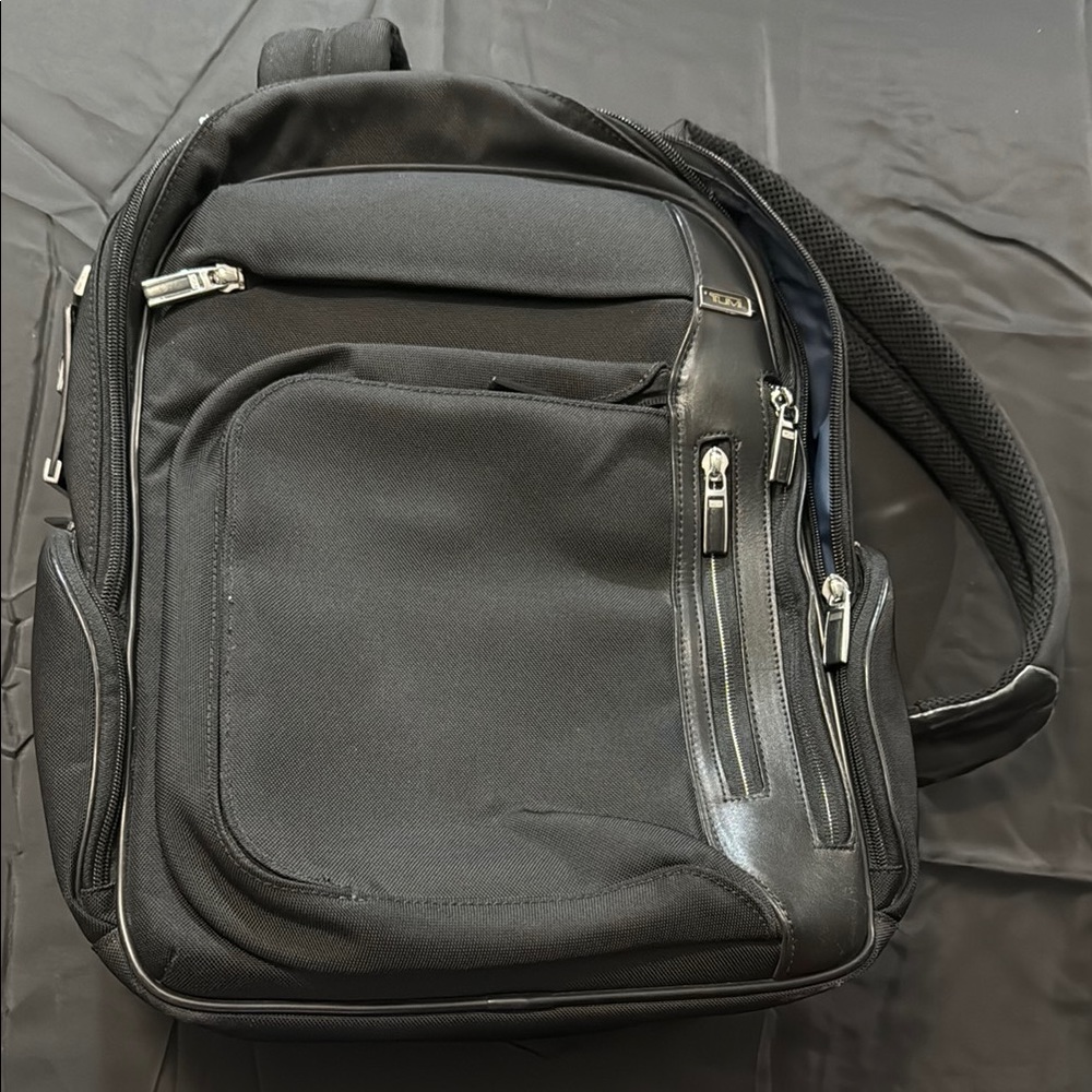 Tumi arrive kingsford black backpack canvas
